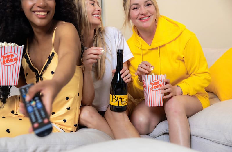 Three Butter besties watching a movie with their Butter wine and popcorn