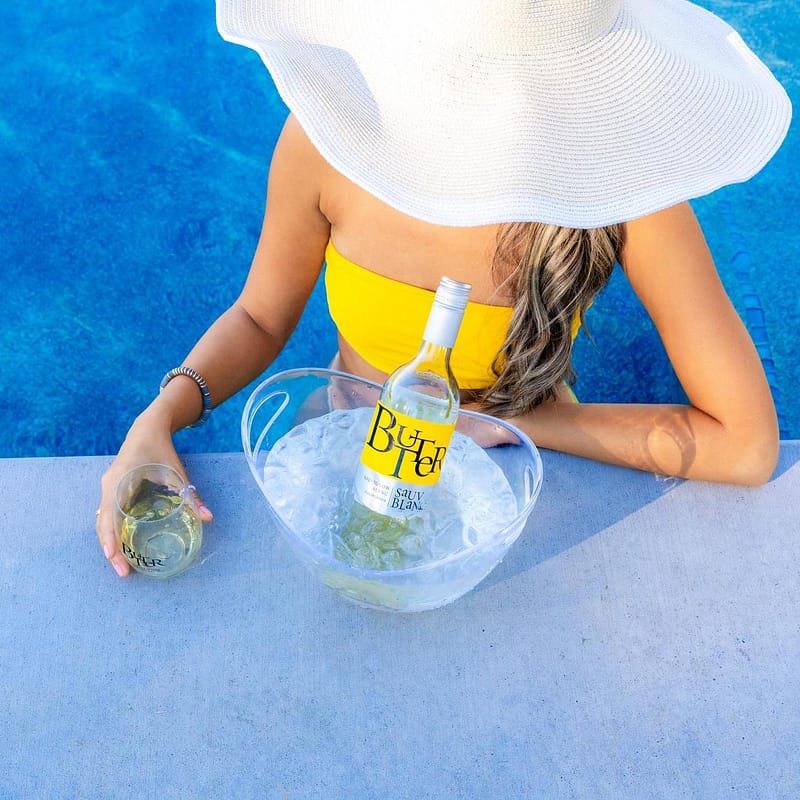 NEW Butter Sauv Blanc is enjoyed by the pool in the summer